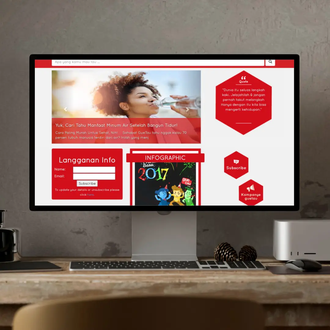 Homepage GueTau.com ditampilkan dalam mockup layar desktop